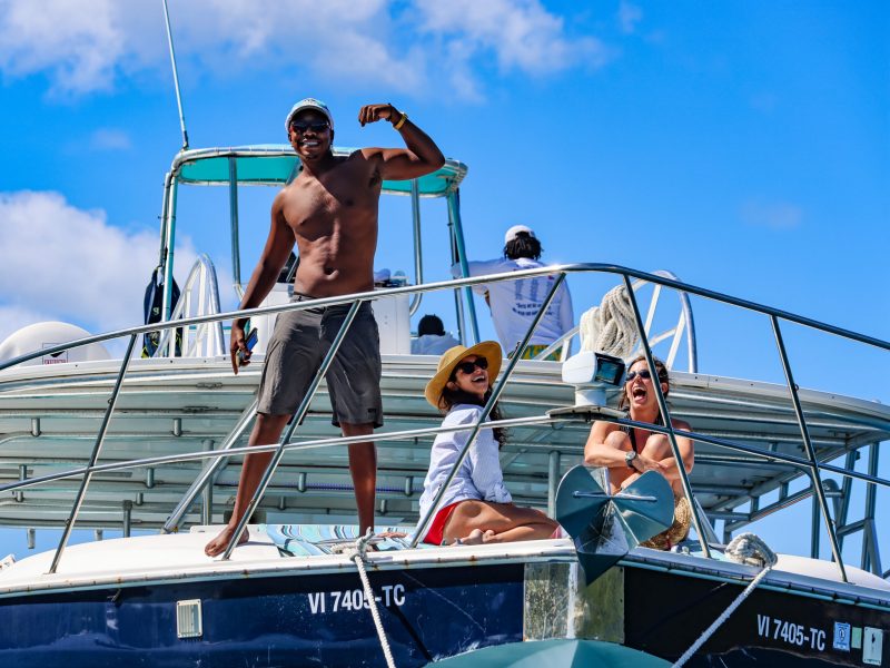 a group of people riding on the back of a boat