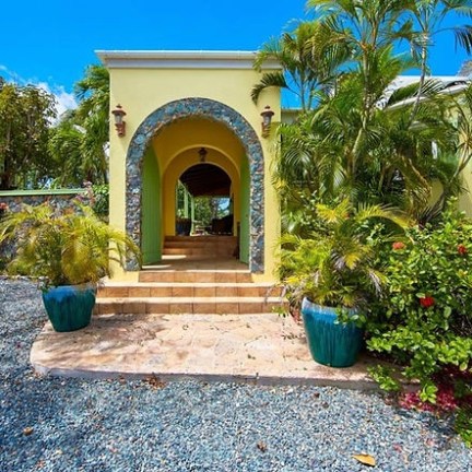 a blue bench in front of a building