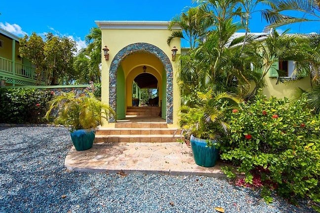 a blue bench in front of a building