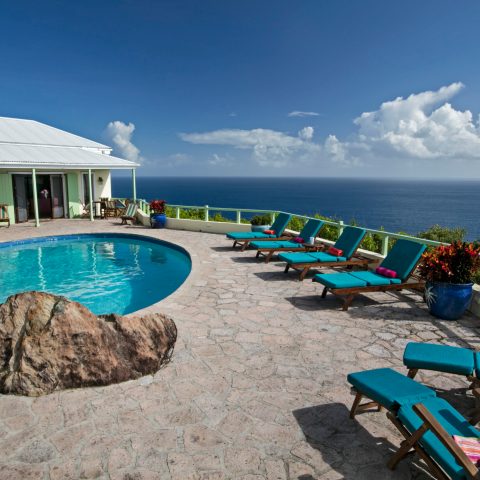 a group of people sitting at a beach