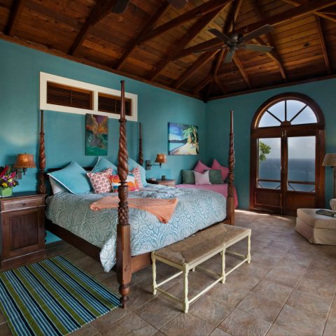 a room filled with furniture and a large window