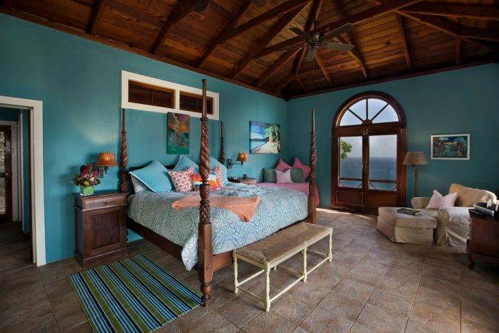 a room filled with furniture and a large window