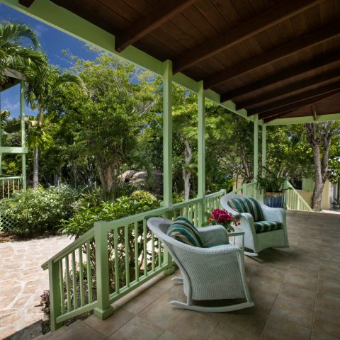 a chair sitting in front of a building