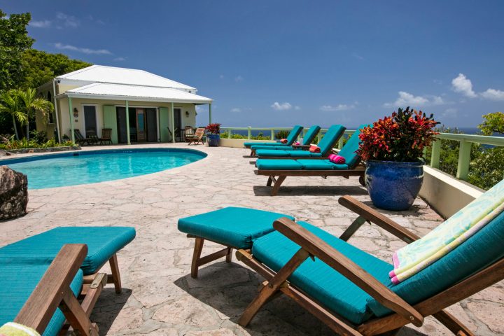 a group of lawn chairs sitting on top of a picnic table