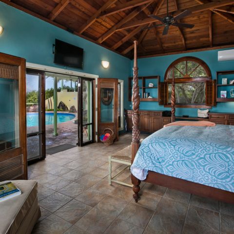 a living room filled with furniture and a large window