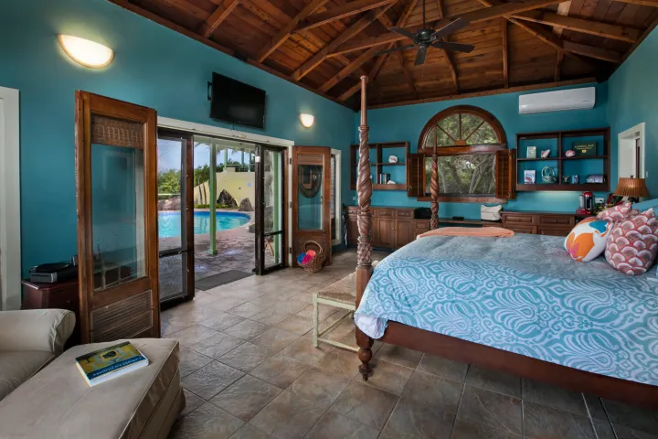 a living room filled with furniture and a large window