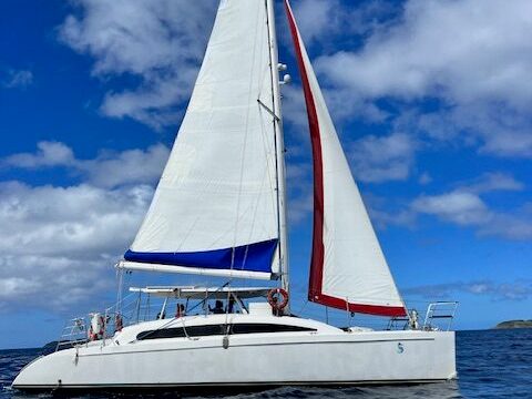 Seas the Day Charters USVI catamaran SY Argo under full sail